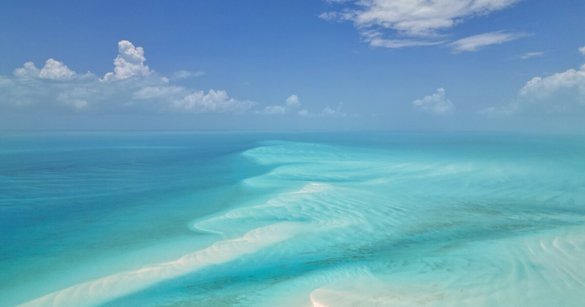 Aerial view of a white Exuma sandbar surrounded by clear turquoise water