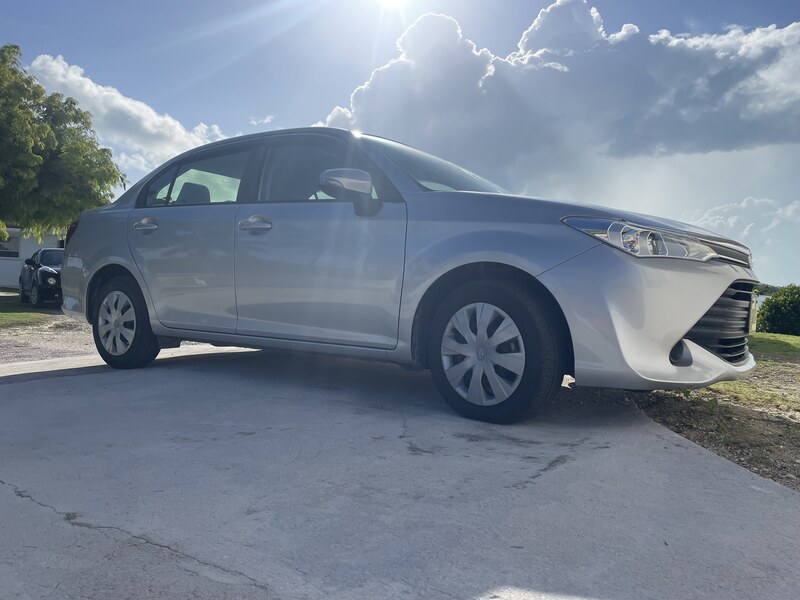 White car parked in the sunshine on Great Exuma
